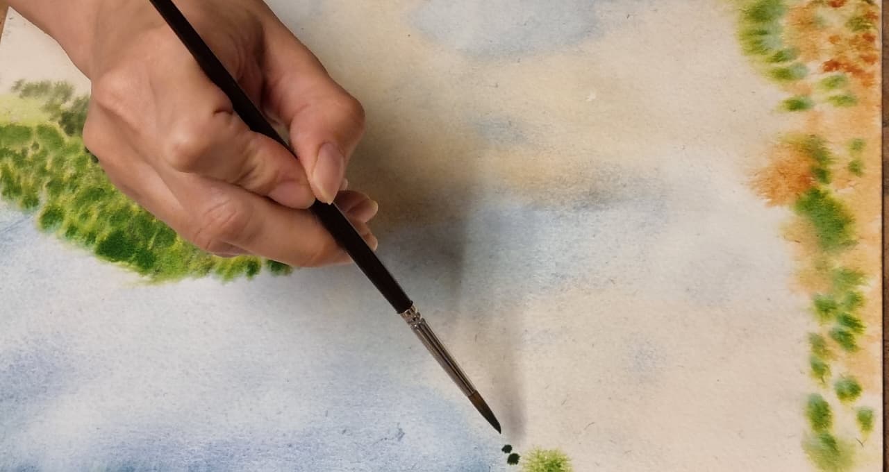 Pincelada sobre un paisaje de acuarela